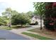 Inviting home exterior with a well-manicured front yard and a circular driveway at 433 Abbey Springs Way, Mcdonough, GA 30253