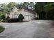 House exterior showcasing a spacious driveway and a two-car garage at 433 Abbey Springs Way, Mcdonough, GA 30253