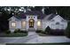 A beautiful front view of a single Gathering house featuring a well-manicured lawn and mature landscaping at 433 Abbey Springs Way, Mcdonough, GA 30253