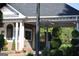 Community guard house with brick exterior, security gate, and manicured landscaping at 433 Abbey Springs Way, Mcdonough, GA 30253