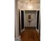 Entry hallway with decorative niche and hardwood flooring at 433 Abbey Springs Way, Mcdonough, GA 30253