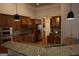 Updated kitchen with granite countertops, stainless appliances, and wood cabinetry at 433 Abbey Springs Way, Mcdonough, GA 30253
