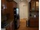 Kitchen with hardwood floors, stainless steel appliances and wood cabinets at 433 Abbey Springs Way, Mcdonough, GA 30253