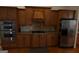 Spacious kitchen featuring stainless steel appliances, granite countertops and wood cabinets at 433 Abbey Springs Way, Mcdonough, GA 30253
