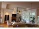 Spacious living room with hardwood floors and a view of the kitchen bar at 433 Abbey Springs Way, Mcdonough, GA 30253