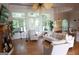 Spacious living room with hardwood floors, large windows, and a view of the outdoors at 433 Abbey Springs Way, Mcdonough, GA 30253
