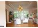 Bright living room featuring hardwood floors, a fireplace, and plenty of natural light at 433 Abbey Springs Way, Mcdonough, GA 30253