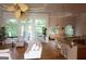Spacious living room with hardwood floors, large windows, and a view of the outdoors at 433 Abbey Springs Way, Mcdonough, GA 30253