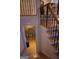 Staircase leading down to finished basement area with 'Personal Cave' sign and stone accent wall at 433 Abbey Springs Way, Mcdonough, GA 30253