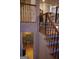 Staircase leading down to finished basement area with 'Personal Cave' sign and stone accent wall at 433 Abbey Springs Way, Mcdonough, GA 30253