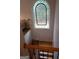 A staircase featuring wood steps and black metal railings and a decorative window at 433 Abbey Springs Way, Mcdonough, GA 30253