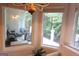Cozy sunroom with outdoor views, comfortable seating, and abundant natural light at 433 Abbey Springs Way, Mcdonough, GA 30253