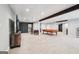Finished basement offering entertainment area with a pool table and a large screen television at 140 Alford Dr, Fayetteville, GA 30215