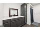 Bathroom featuring a modern vanity with solid surface countertops and a tiled shower at 140 Alford Dr, Fayetteville, GA 30215