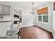 Bright dining area with hardwood floors, chandelier and natural light at 140 Alford Dr, Fayetteville, GA 30215