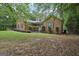 Beautiful brick home with well-maintained lawn and mature trees at 140 Alford Dr, Fayetteville, GA 30215