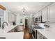 Beautiful modern kitchen with gray cabinets, stainless steel appliances and ample counter space at 140 Alford Dr, Fayetteville, GA 30215