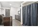 Laundry room featuring a washer, dryer, and a washbasin behind a shower curtain at 140 Alford Dr, Fayetteville, GA 30215
