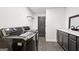 Well-equipped laundry room featuring modern appliances and a stylish herringbone tile floor at 140 Alford Dr, Fayetteville, GA 30215