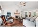 Cozy living room with vaulted ceiling, fireplace and natural light from windows at 140 Alford Dr, Fayetteville, GA 30215