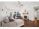 Comfortable living room with hardwood floors, fireplace and cozy sectional sofa at 140 Alford Dr, Fayetteville, GA 30215