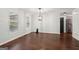 Bright living room featuring hardwood floors and neutral walls with large windows at 140 Alford Dr, Fayetteville, GA 30215