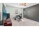 Spacious home office featuring a dark accent wall and large flat screen television at 140 Alford Dr, Fayetteville, GA 30215