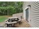 This outdoor space is perfect for dining al fresco, with a picnic table and nearby entrance to the home at 140 Alford Dr, Fayetteville, GA 30215