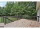 A wooden deck overlooks the green backyard at 140 Alford Dr, Fayetteville, GA 30215