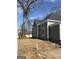 Side of a gray home featuring new siding, windows, and a newly renovated exterior at 1419 Cleveland Ave, Atlanta, GA 30344