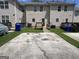 A backyard view featuring a newly refinished wooden deck and patio parking for two vehicles at 160 Odyssey Turn, Conyers, GA 30012