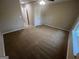 Bedroom featuring neutral carpet, neutral paint, and standard ceiling fan with lighting fixture at 160 Odyssey Turn, Conyers, GA 30012