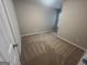 Bedroom featuring a neutral paint color, carpet, and a window at 160 Odyssey Turn, Conyers, GA 30012