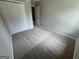 Bedroom with beige carpet, featuring a double door closet at 160 Odyssey Turn, Conyers, GA 30012