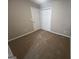 Bedroom showcasing carpet and a closet with double doors at 160 Odyssey Turn, Conyers, GA 30012