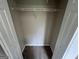 View of an open empty closet space, featuring brown carpet and a rack at 160 Odyssey Turn, Conyers, GA 30012