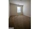Bright bedroom with carpet and window letting in natural light at 6342 Kinsland Ct, Lithonia, GA 30058