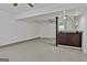 Spacious basement featuring bar area with granite countertops and plenty of room for entertaining at 9138 Sunset Dr, Jonesboro, GA 30238