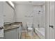 Clean bathroom features a combined shower and tub, a white vanity, and updated fixtures at 9138 Sunset Dr, Jonesboro, GA 30238
