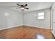 Bright bedroom features ceiling fan and gleaming hardwood floors, offering a comfortable retreat at 9138 Sunset Dr, Jonesboro, GA 30238