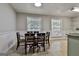 Cozy dining room with tile floors, natural light, and neutral tones at 9138 Sunset Dr, Jonesboro, GA 30238