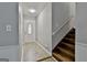 Bright entryway featuring tile floor, staircase, and a stylish front door at 9138 Sunset Dr, Jonesboro, GA 30238