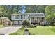 Charming home with stone accents, a front porch, and manicured lawn at 9138 Sunset Dr, Jonesboro, GA 30238