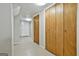 Hallway with neutral color walls and doors leading to the different sections of the house at 9138 Sunset Dr, Jonesboro, GA 30238