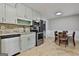 Bright kitchen with stainless steel appliances, granite countertops, and adjacent dining area at 9138 Sunset Dr, Jonesboro, GA 30238