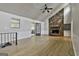 Spacious living room with hardwood floors and a stunning stone fireplace at 9138 Sunset Dr, Jonesboro, GA 30238
