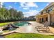 Backyard oasis features a pool with waterfall and ample patio space for outdoor living at 150 Dean Dr, Tyrone, GA 30290