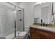 Bathroom features a glass enclosed tiled shower, granite countertop vanity, and white fixtures at 150 Dean Dr, Tyrone, GA 30290