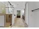 Spacious bathroom with tan tile, glass shower, soaking tub and backyard views at 150 Dean Dr, Tyrone, GA 30290