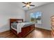 Cozy bedroom with wood flooring, ceiling fan, and natural light at 150 Dean Dr, Tyrone, GA 30290